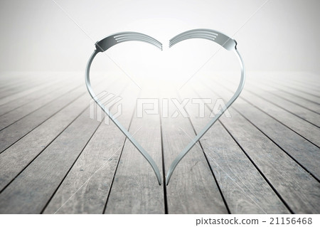 Forks heart on wood background 21156468