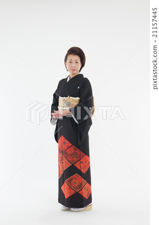 Woman in a formal kimono, dressing, black formal kimono Woman in a formal kimono, dressing, black formal kimono 21157445