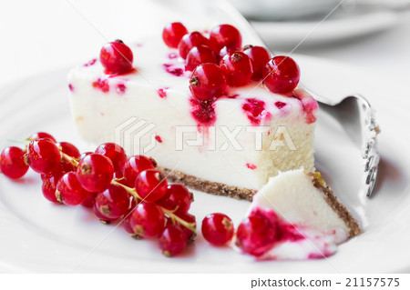 Red currant cheesecake on plate with fork Red currant cheesecake on plate with fork 21157575