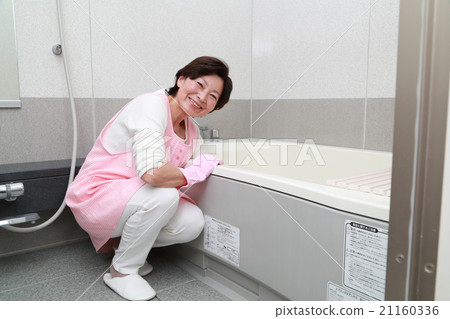 A woman cleaning a bath A woman cleaning a bath 21160336