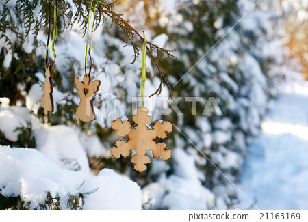 Beautiful wooden toys hanging on Christmas tree 21163169