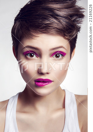 Portrait of beautiful girl with red lips. 21169226