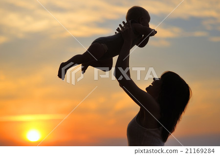 Woman with little baby as silhouette 21169284