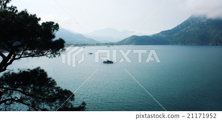 View on Adrasan Bay. Tourist boat in the sea. 21171952