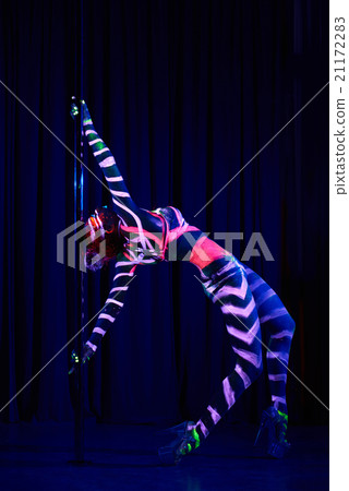 Female pole dancer in neon colours under ultraviolet (UV) light 21172283