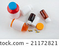 Different color pharmaceutical bottles and pills 21172821