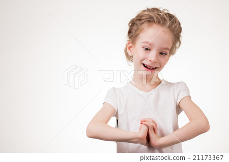 Portrait of surprised excited girl covering her 21173367