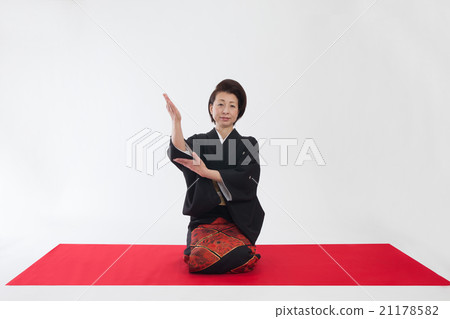 A lady sitting on a sleeve 21178582