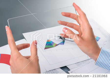 Businesswoman's hands holding glass tablet. Businesswoman's hands holding glass tablet. 21181068