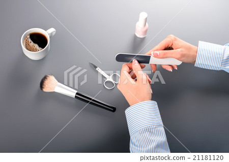 Close-up of woman making manicure. Close-up of woman making manicure. 21181120