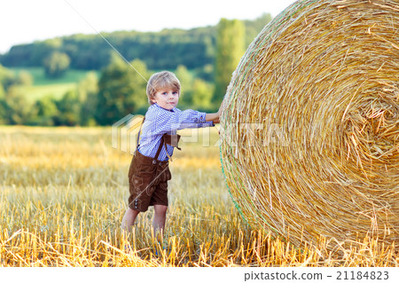 Funny little kid boy in leather shors, walking 21184823