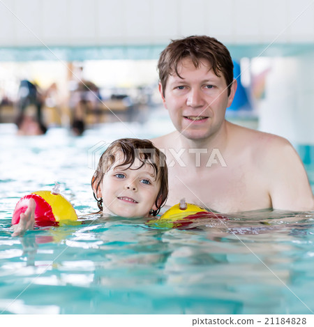 Cute little boy and his father having fun in Cute little boy and his father having fun in 21184828