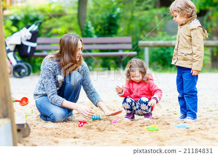 mother and two little children playing on mother and two little children playing on 21184831