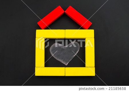 Wooden toy house with heart inside 21185638