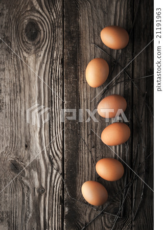 Chicken eggs on a wooden table Chicken eggs on a wooden table 21191963
