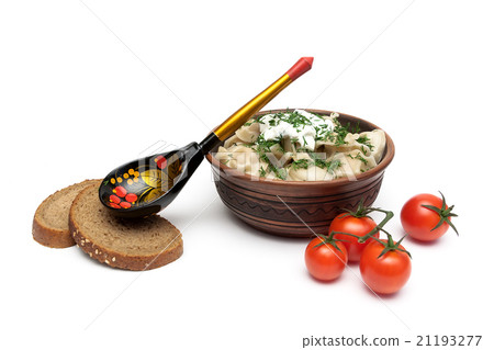 Russian dumplings with sour cream in a clay plate Russian dumplings with sour cream in a clay plate 21193277
