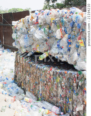Plastic bottles pressed and packed for recycling 21194210