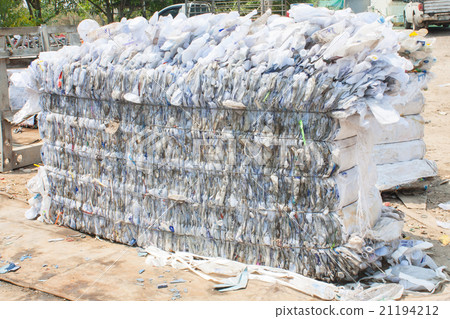 Plastic bottles pressed and packed for recycling 21194212