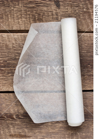 An open roll of paper on the wooden table An open roll of paper on the wooden table 21194576