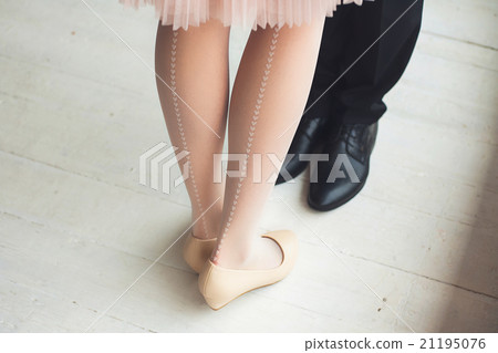 Female and male legs in rustic interior 21195076