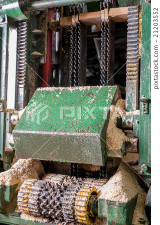 Image of sawing machine covered with sawdust Image of sawing machine covered with sawdust 21203552