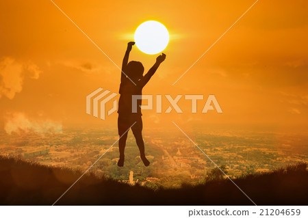 boy happy jumping touch the sun boy happy jumping touch the sun 21204659