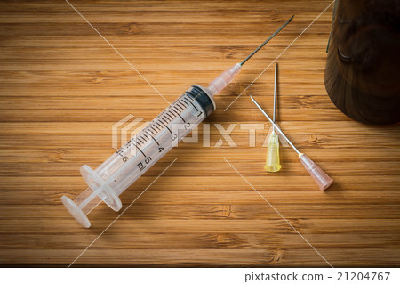 Syringe on the wood 2 21204767
