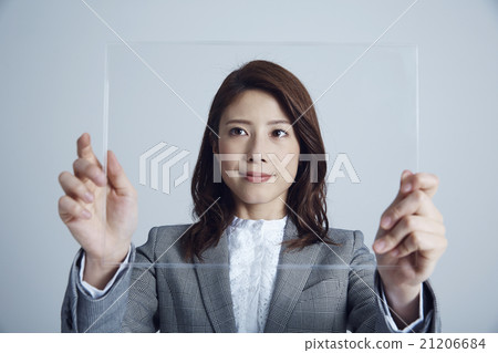 A woman operating a panel A woman operating a panel 21206684