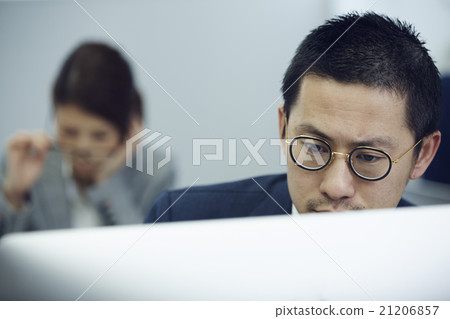 Businessman using a personal computer 21206857
