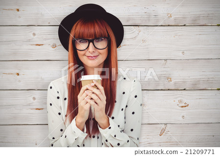 Composite image of smiling hipster woman drinking coffee 21209771