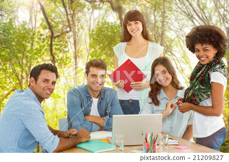 Composite image of smiling casual colleagues in a meeting 21209827