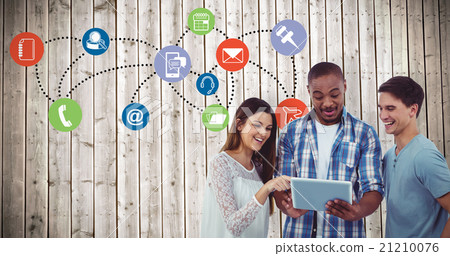 Composite image of young creative team looking at tablet 21210076