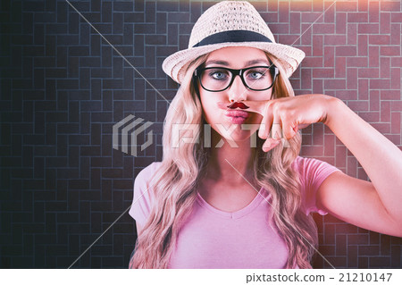 Composite image of a beautiful hipster having a fake distinguish Composite image of a beautiful hipster having a fake distinguish 21210147