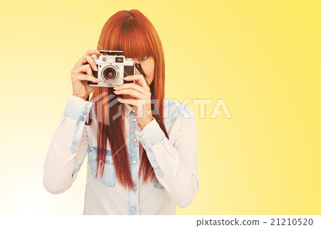 Composite image of attractive hipster photographing with camera 21210520