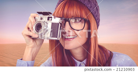 Composite image of smiling hipster woman taking pictures with a Composite image of smiling hipster woman taking pictures with a 21210903