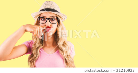 Composite image of a beautiful hipster having a fake distinguish Composite image of a beautiful hipster having a fake distinguish 21210922