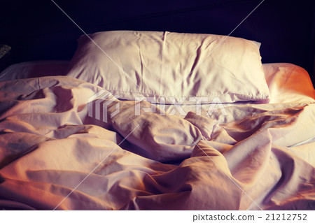 Messy white bed and pillow in the morning Messy white bed and pillow in the morning 21212752