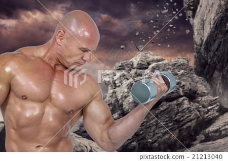 Composite image of bodybuilder concentrating while lifting dumbb 21213040