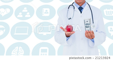 Composite image of male doctor holding red apple and banknote 21213924