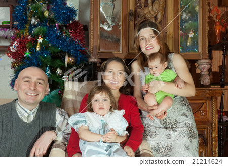 couple with baby girls visiting grandmother 21214624