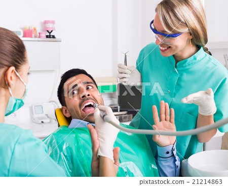 doctor and frightened patient at clinic doctor and frightened patient at clinic 21214863