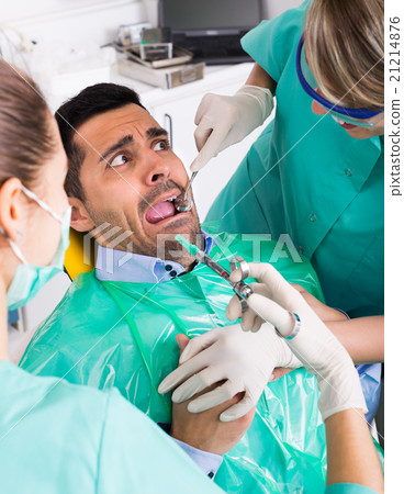 doctor and frightened patient at clinic 21214876