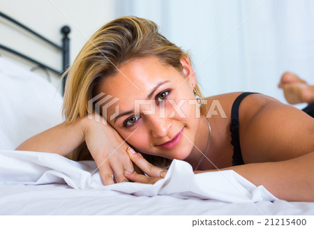 Young sensual woman in bedroom. 21215400