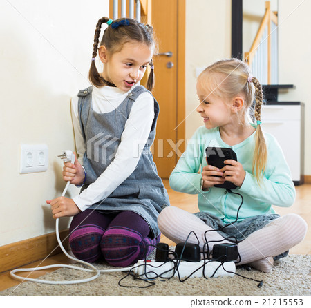 children playing with sockets and electricity indoors children playing with sockets and electricity indoors 21215553