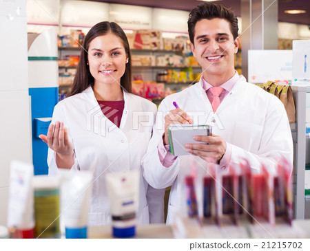 Young team in chemist shop 21215702