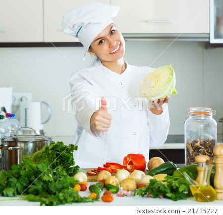 Woman in uniform at kitchen Woman in uniform at kitchen 21215727