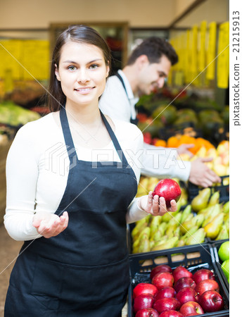 sellers offering seasonal sweet apples in grocery 21215913