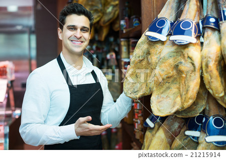 Seller in delicatessen section 21215914