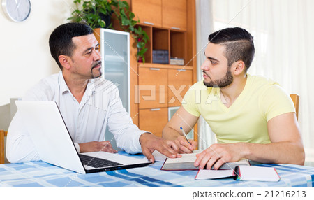 father helping his son father helping his son 21216213