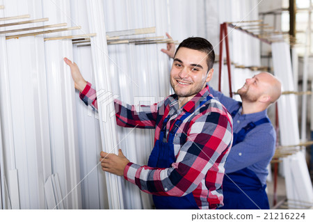 workmen inspecting window frames 21216224
